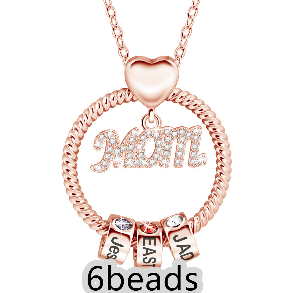 Rose gold necklace with 'Mom' and name beads on a white background 6 beads