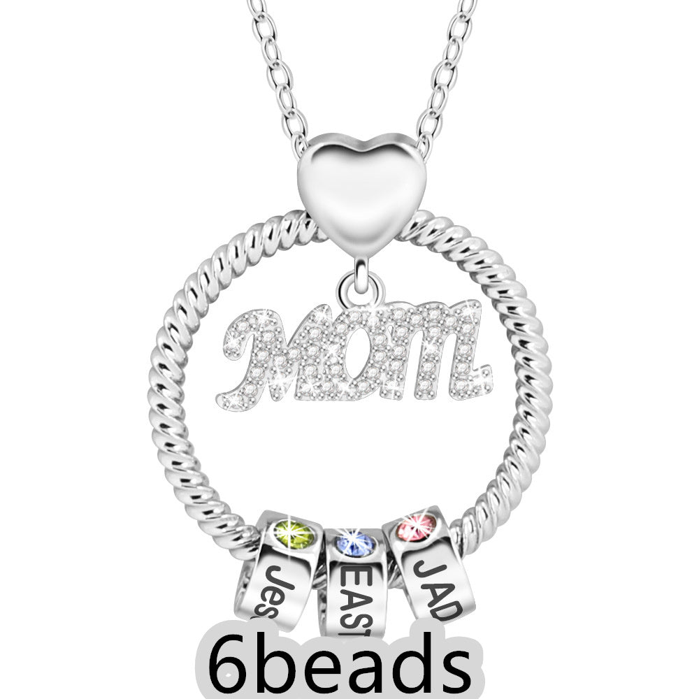 Silver necklace with 'Mom' pendant and three name beads on a white background 6  beads