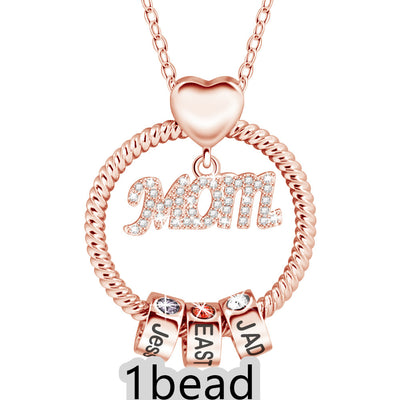 Rose gold necklace with 'Mom' and three name beads on a white background 1  bead