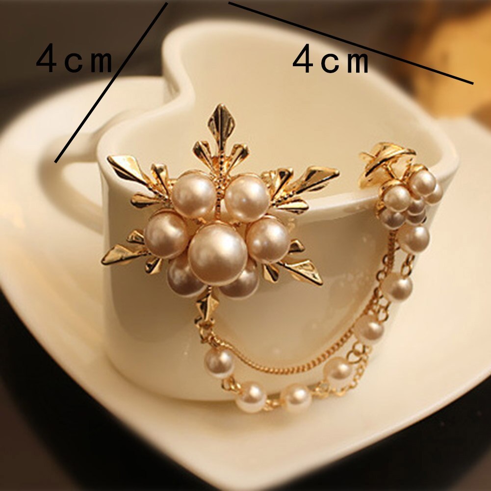 Gold and pearl bracelet on a white cup with measurements indicated