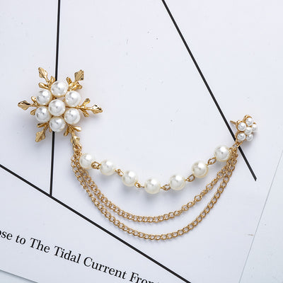 Gold and pearl necklace on a white background