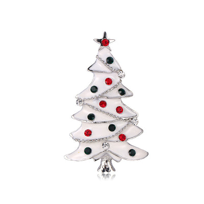 Christmas tree-shaped brooch with red and black decorations on a white background