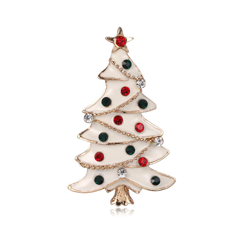 Christmas tree-shaped brooch with red, green, and gold colors on a white background
