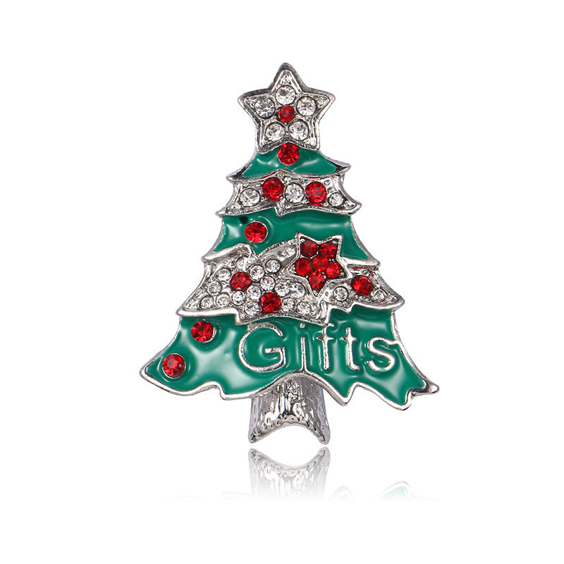 Christmas tree-shaped brooch with red rhinestones and 'Gifts' text on a white background