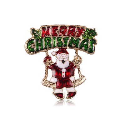 Christmas-themed brooch with Santa Claus and 'Merry Christmas' text on a white background