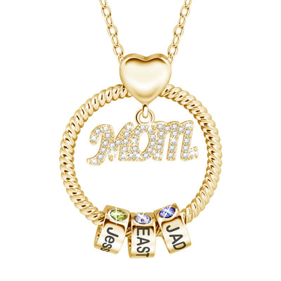 Gold necklace with 'Mom' pendant and name charms on a white background