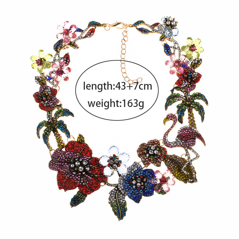 Colorful necklace with floral and flamingo designs on a white background and measurements 