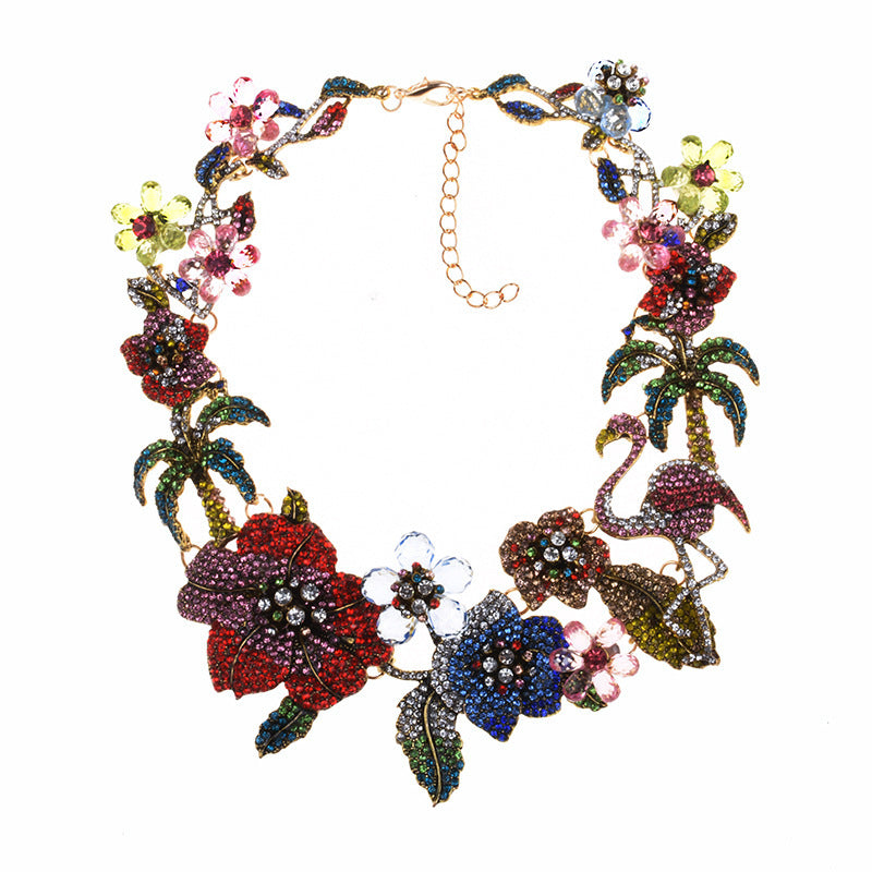 Colorful floral and flamingo necklace on a white background