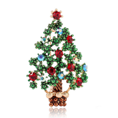 Christmas tree brooch with green, red, and gold colors on a white background