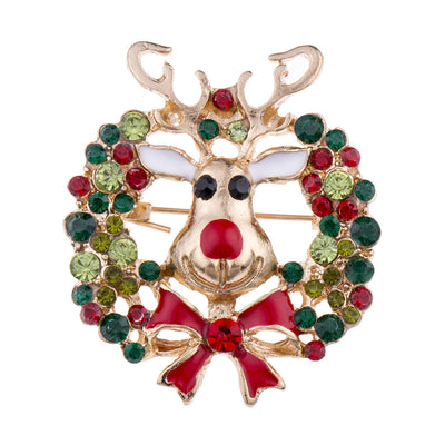 Decorative reindeer brooch with gemstones on a white background