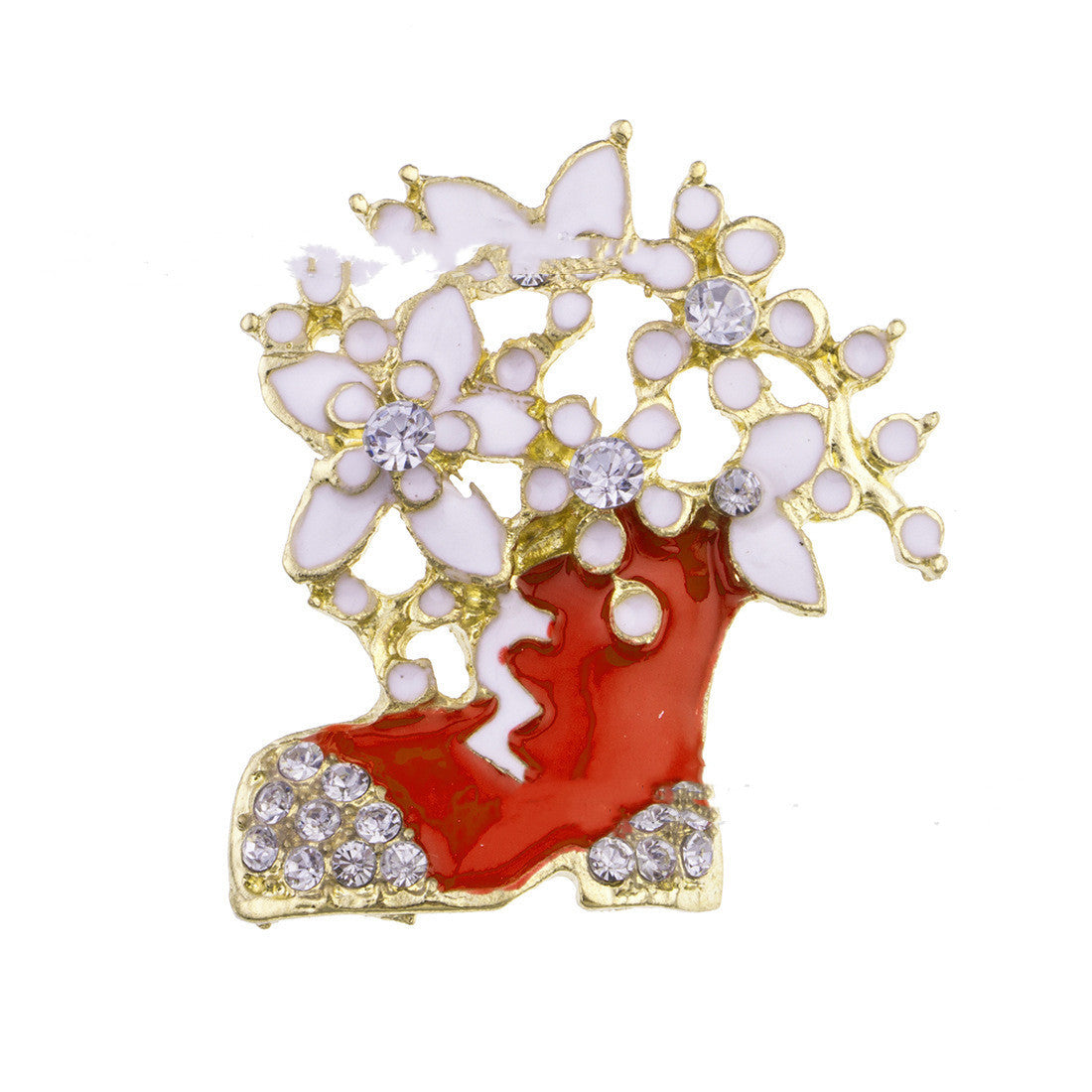 Decorative brooch with red shoe, white flowers, and gold accents on a white background