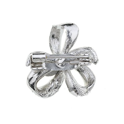 back side of the bow brooch on a white background