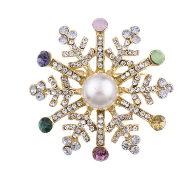 Decorative brooch with pearl center and multicolored gemstones on a white background