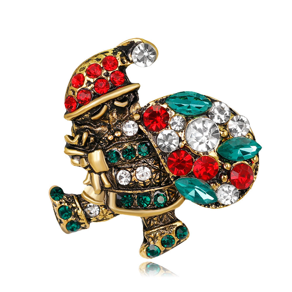 Decorative brooch with colorful gemstones on a white background