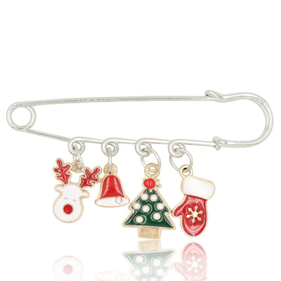 Silver brooch with Christmas-themed charms including a reindeer, Santa hat, tree, and mitten on a white background.