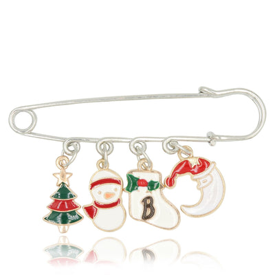 Christmas-themed brooch with charms including a tree, snowman, stocking, and letter 'B' on a white background.