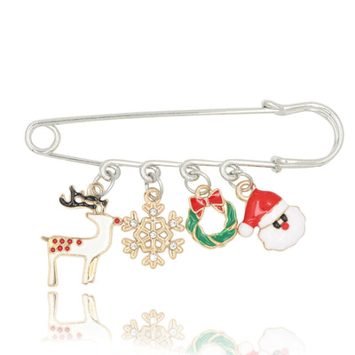 Brooch with Christmas-themed charms including a reindeer, snowflake, wreath, and Santa Claus on a white background.
