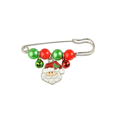 Christmas-themed safety pin with beads and Santa Claus charm on a white background
