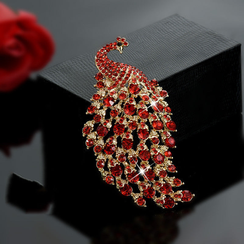 Decorative brooch with red gemstones on a dark background