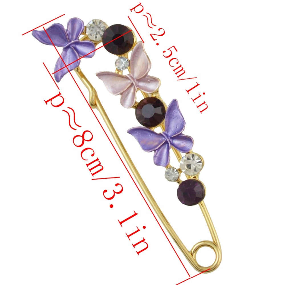 Decorative brooch with butterfly designs and measurements on a white background