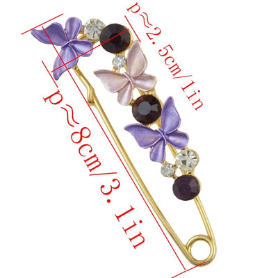 Decorative brooch with butterfly designs and measurements on a white background