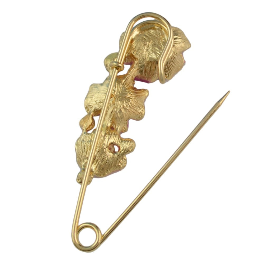 back view of a pin  brooch with leaf design on a white background