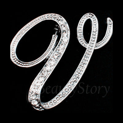 Silver bracelet with clear stones of letter V on a black background