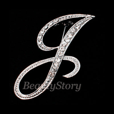 Silver letter 'J' with rhinestones on a black background, branded 'BeautyStory'.