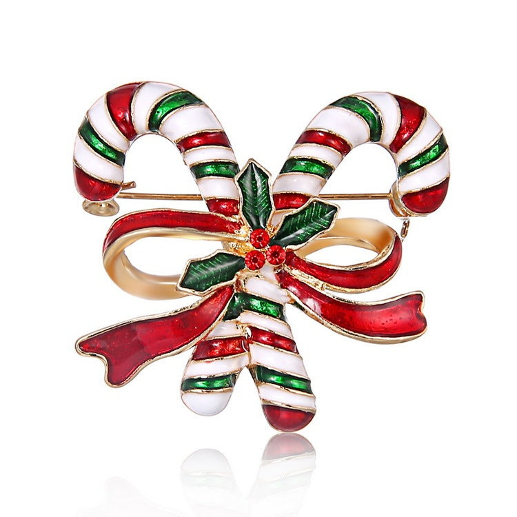 Candy cane-shaped brooch with red, green, and white colors on a white background