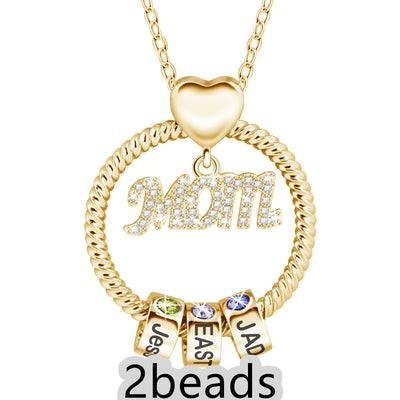 Gold necklace with 'Mom' pendant and three name beads on a white background 2 beads