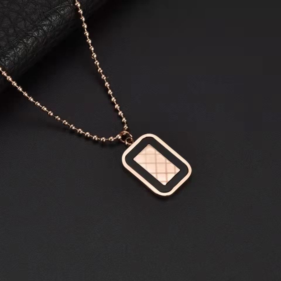 Necklace with a square pendant on a dark background