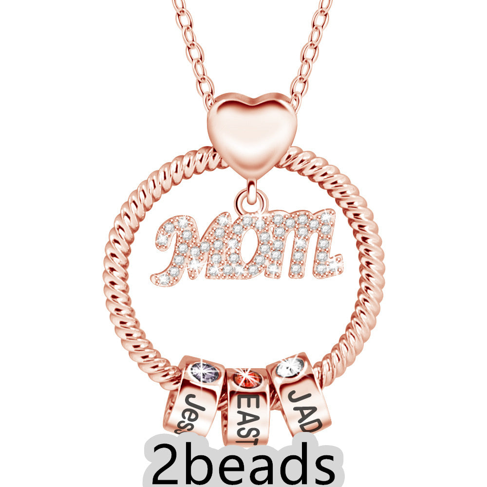 Rose gold necklace with 'Mom' and name charms on a white background 2 beads