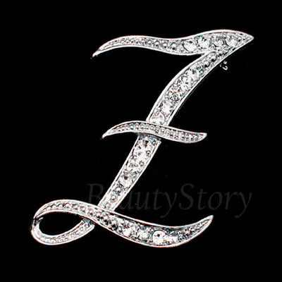 Silver letter 'Z' brooch with crystals on a black background