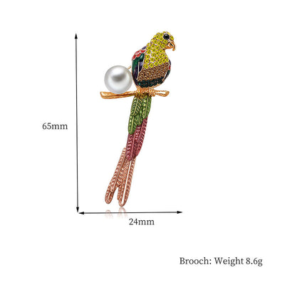Colorful parrot-shaped brooch with pearl on a white background, showing measurements and weight.