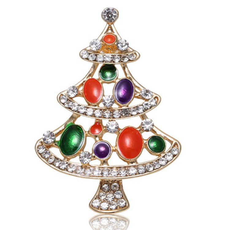 Christmas tree-shaped brooch with colorful gemstones and rhinestones on a white background