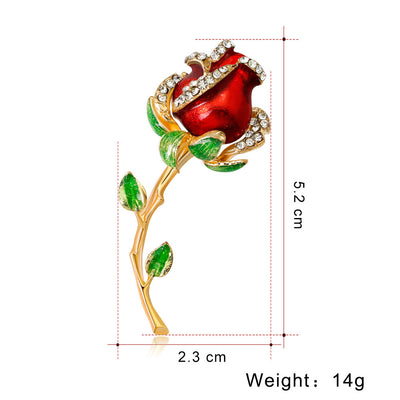Red rose brooch with gold stem and green leaves, shown with measurements and weight on a white background.