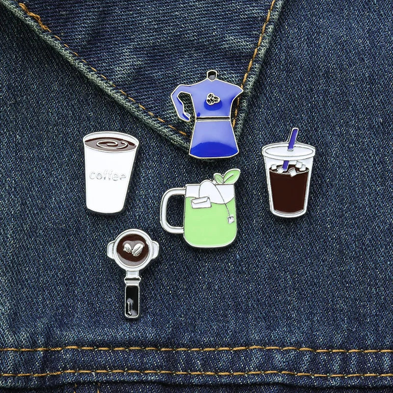 Set of coffee-themed pins on a denim background