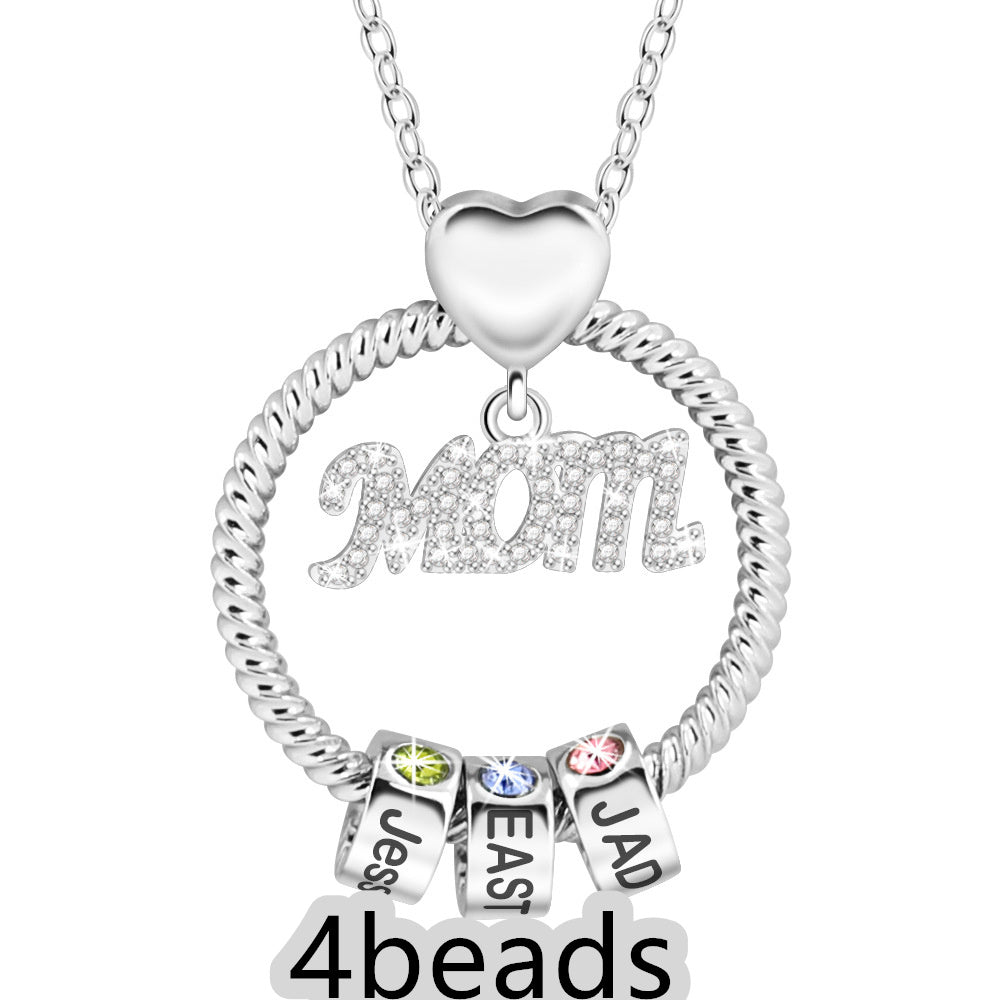 Silver necklace with heart pendant and name beads on a white background 4 beads