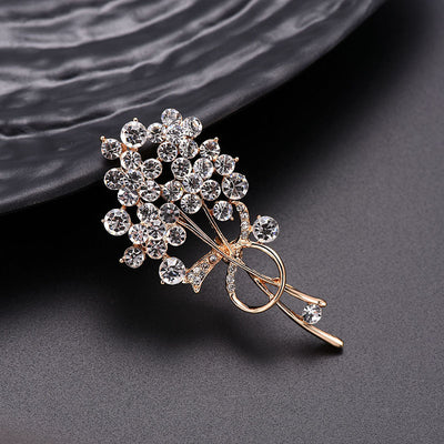 Decorative brooch with crystals on a dark textured surface