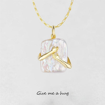 🤍 Iridescent Hands Embrace Necklace – Gold Square Pendant of Love