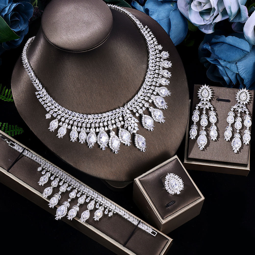 Zircon Bridal set, necklace, bracelet, and earrings on a white background