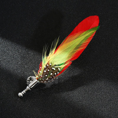 Feathered decorative item with a silver accent on a black background