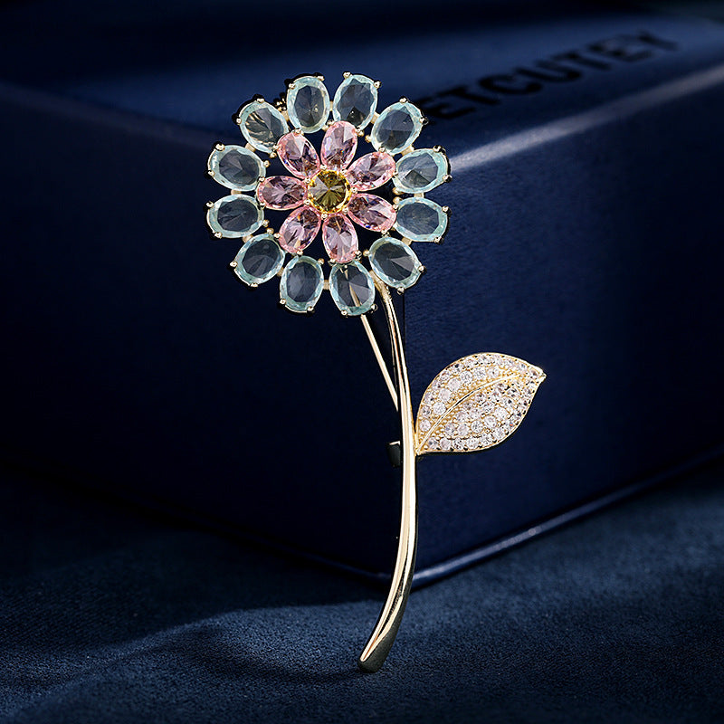 Decorative flower brooch with gemstones on a dark background