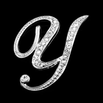 Decorative letter 'y' with rhinestones on a black background
