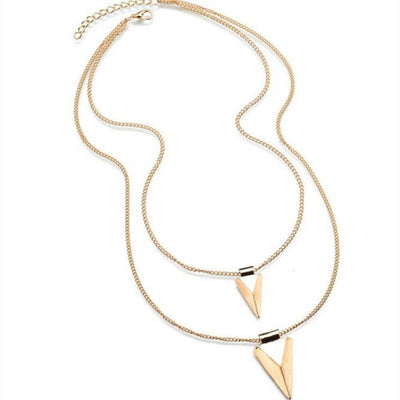 Gold necklace with triangle pendants on a white background