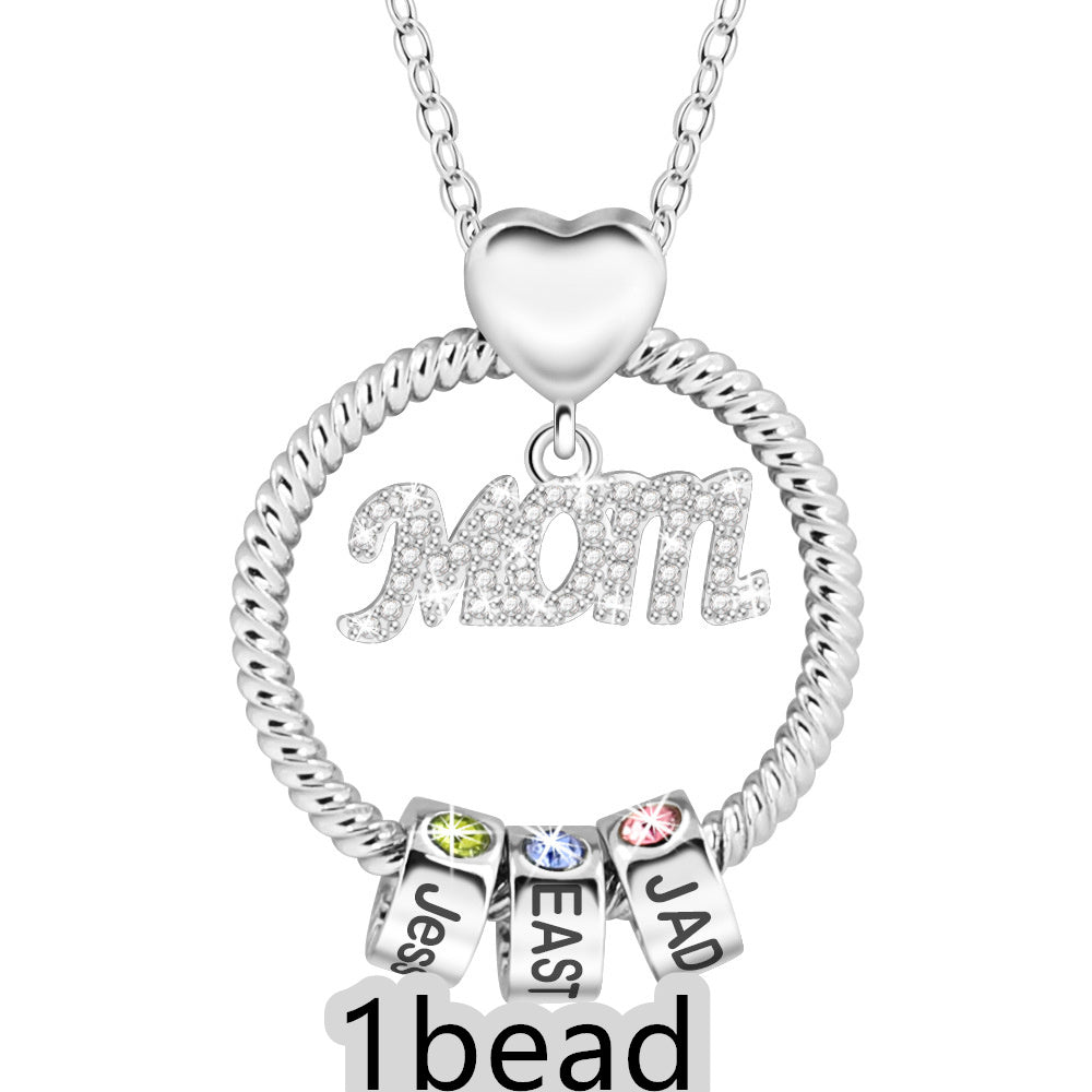 Silver necklace with heart pendant and name charms on a white background 1 bead
