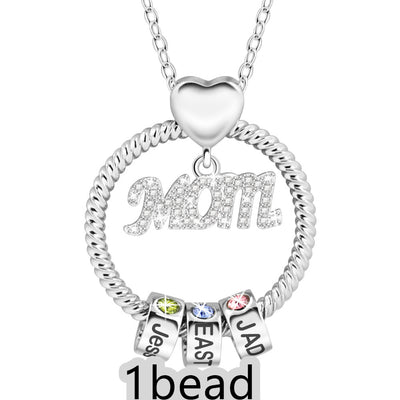 Silver necklace with heart pendant and name charms on a white background 1 bead