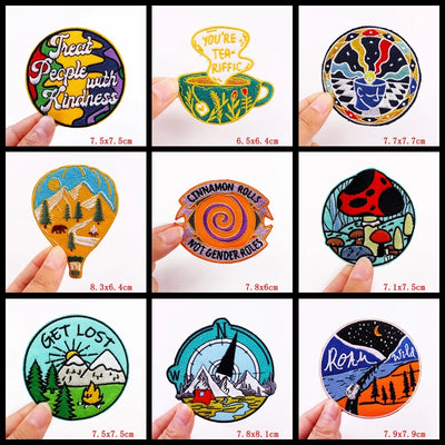 Collection of colorful round stickers held by hands with visible text and designs.