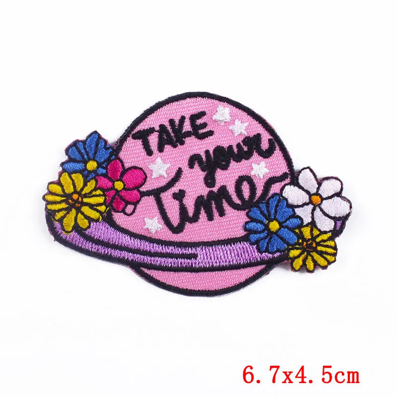Pink patch with flowers and 'Take Your Time' text on a white background