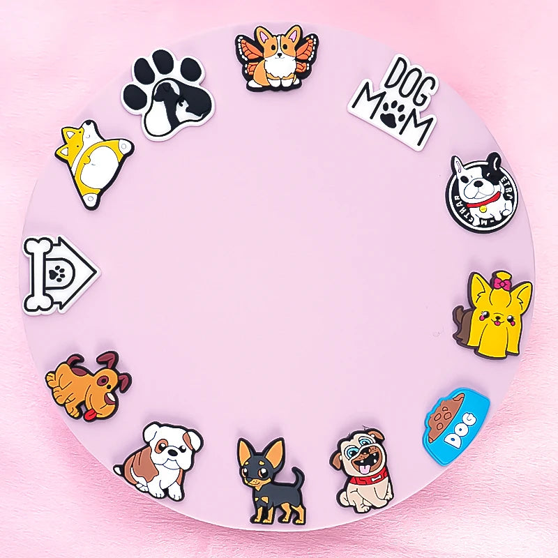 Collection of dog-themed shoe charms on a pink background